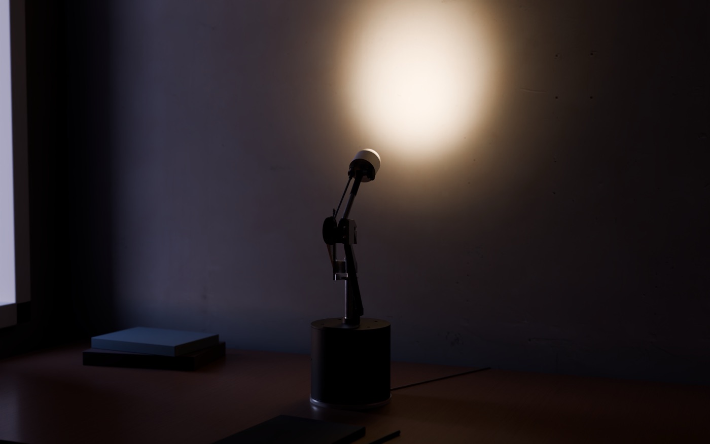 Render of AXON at AMBIENT: the column raised and the head turned to the wall, throwing a soft round patch of warm light onto the plaster above the desk.