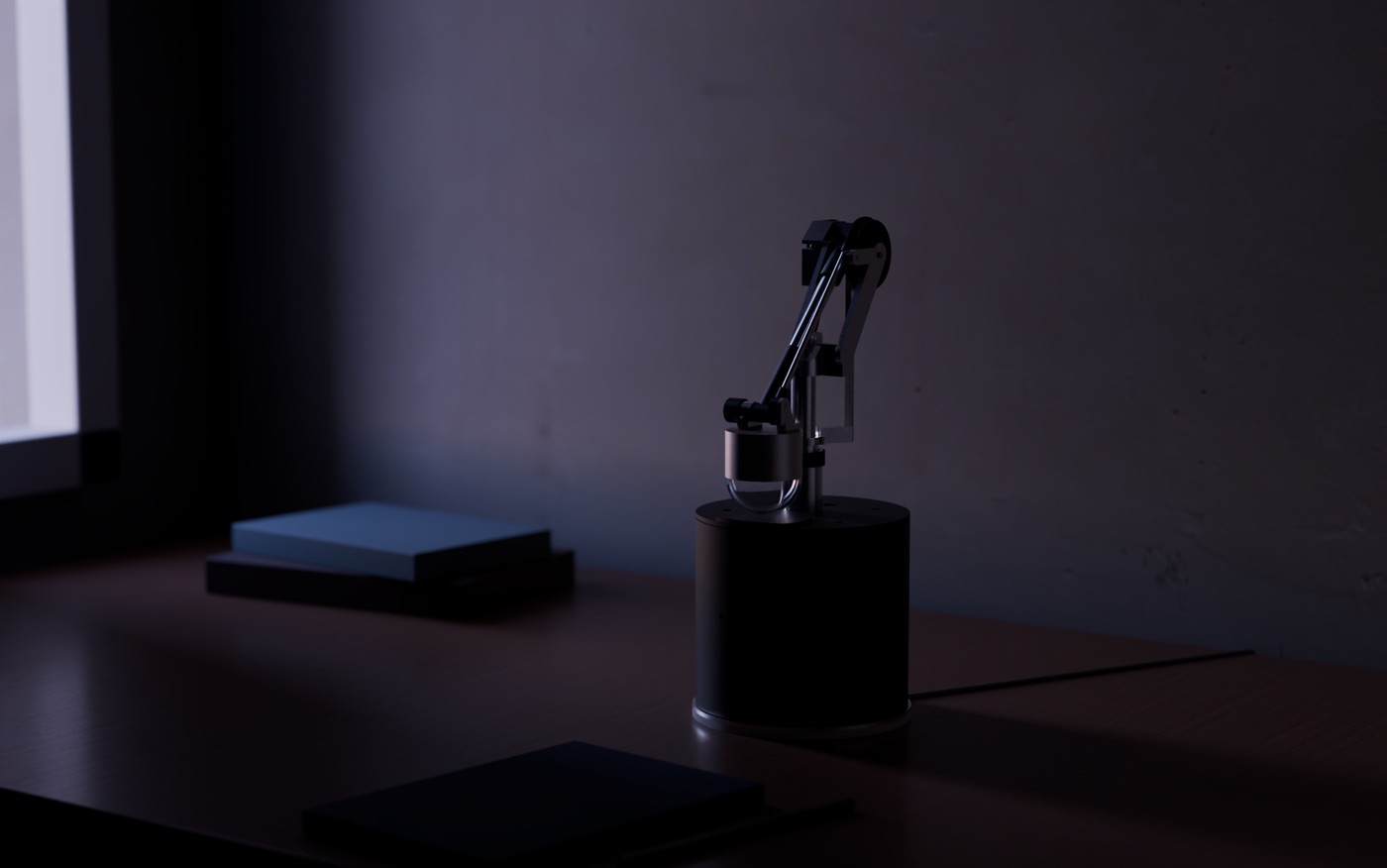 Render of AXON at STOWED on the same desk, switched off: the head lowered onto the top of the base, the arm folded upright behind it, in the blue light of dusk.