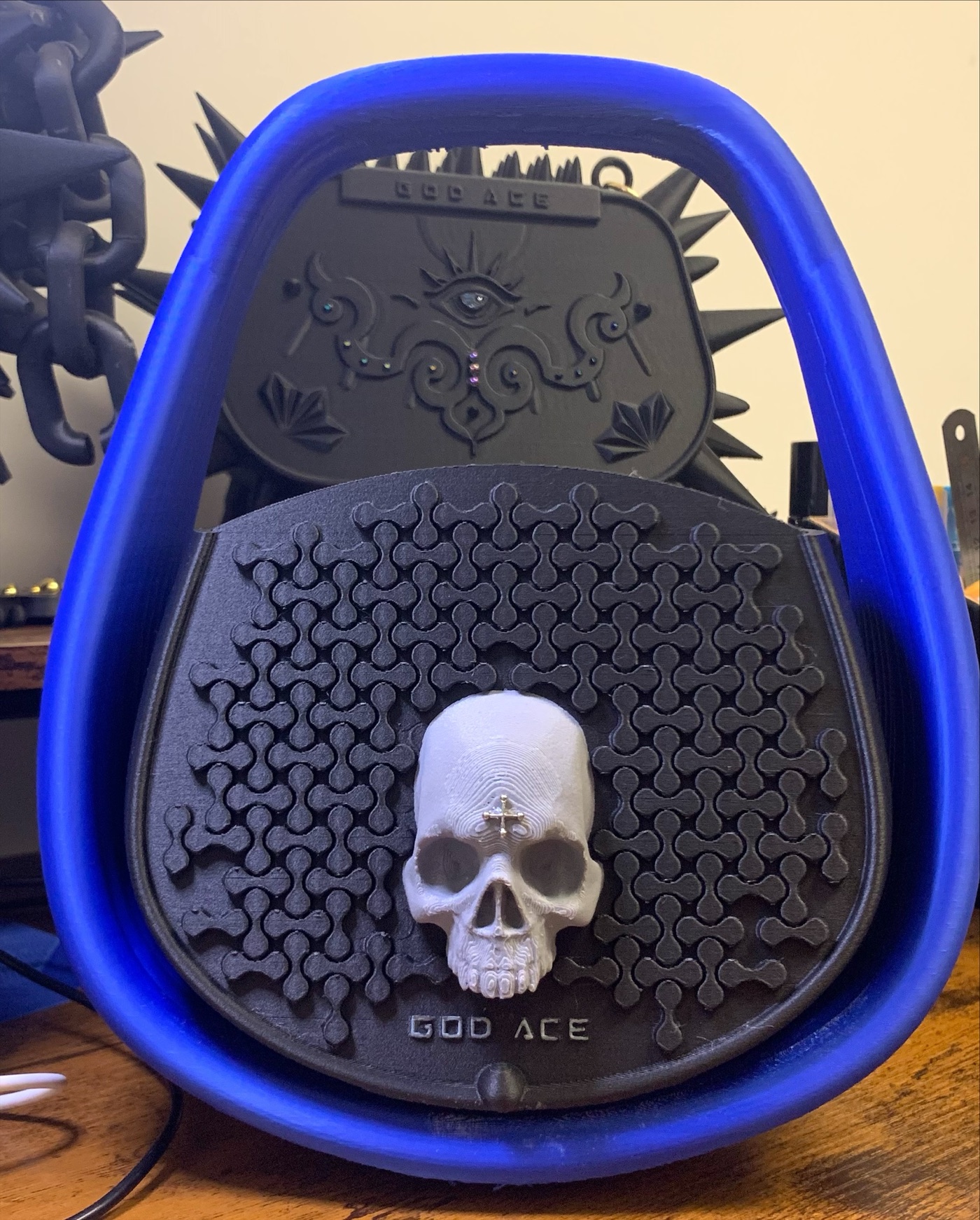 Skull bag · PLA-CF body with a modelled tile texture, blue handle, skull sculpted in Nomad Sculpt · Nov 2025