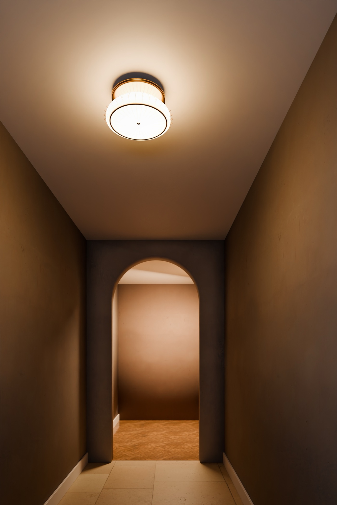 The ceiling light in a staged limestone hallway