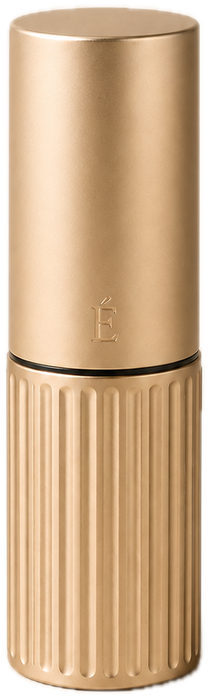AI-generated concept visualisation of the ÉCLOS lipstick closed: satin champagne cap with a small É monogram over a fluted lower body, separated by a thin dark reveal line.