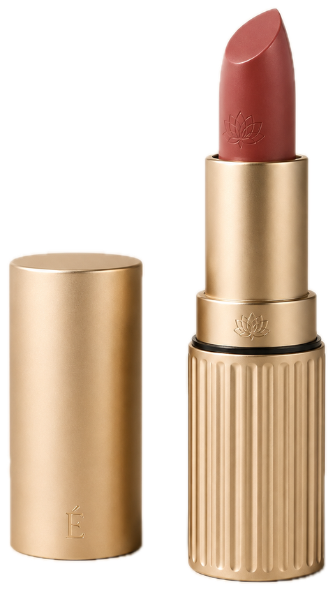 AI-generated concept visualisation of the ÉCLOS lipstick, open: a satin champagne cap standing at left with a small É monogram; at right the fluted champagne body, a thin black reveal, a collar with an engraved lotus, and a muted rose bullet raised from its cup.